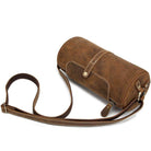 Vintage leather crossbody bag with adjustable strap and stylish buckle detail