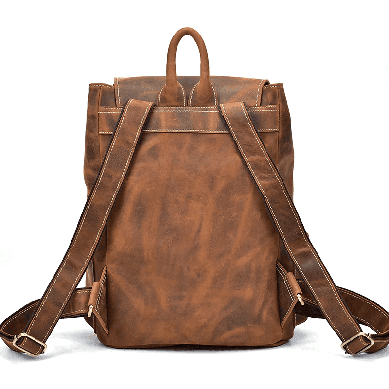 Vintage leather laptop backpack in brown with adjustable straps and spacious main compartment