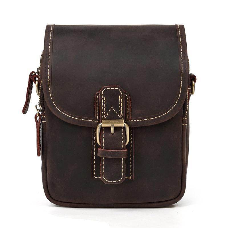 Vintage leather sling bag with a secure buckle closure and durable stitching for everyday use