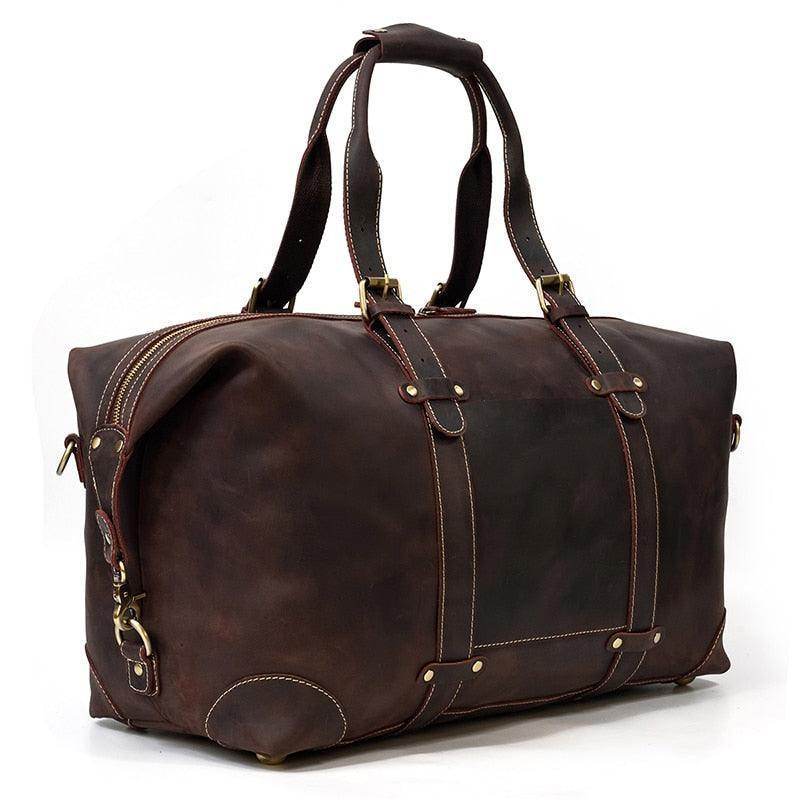 Vintage leather travel bag by VacationGrabs with sturdy handles and spacious design for stylish travel