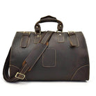 Vintage leather travel bag with a sturdy design and adjustable shoulder strap for convenient journeys