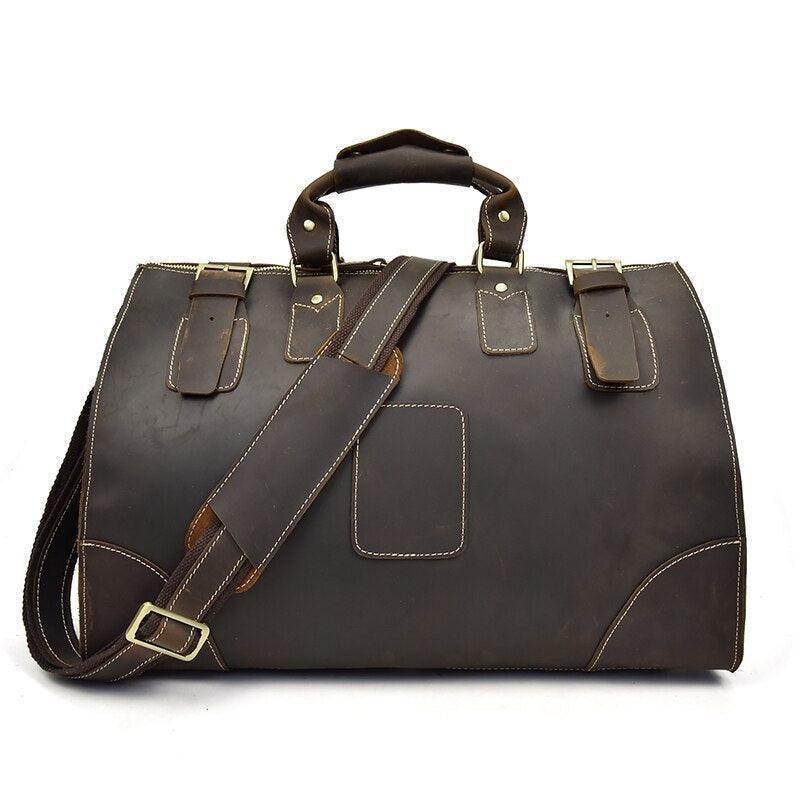 Vintage leather travel bag with sturdy handles and adjustable shoulder strap for stylish journeys
