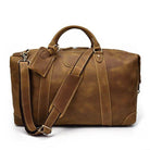 Vintage leather travel bag by VacationGrabs with spacious interior and adjustable shoulder strap