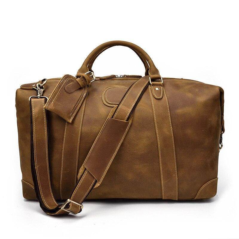 Vintage leather travel bag by VacationGrabs with spacious interior and adjustable shoulder strap