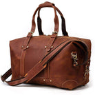 Vintage leather travel bag with sturdy handles and an adjustable shoulder strap for convenient travel