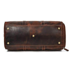 Vintage leather travel duffle bag with brass feet and a rich brown finish for stylish travel