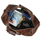 Vintage leather travel duffle spacious interior with tablet camera and clothing stored inside