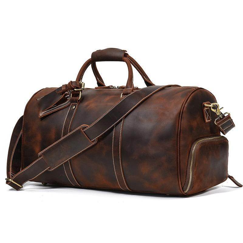 Vintage leather travel duffle bag with top handles and adjustable shoulder strap for stylish journeys