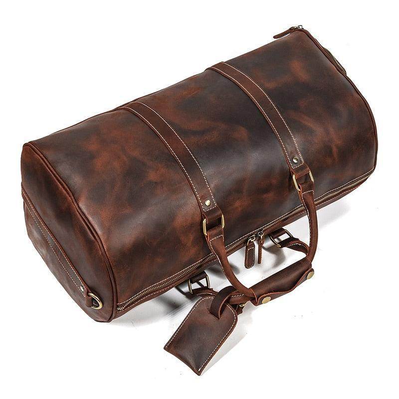 Vintage leather travel duffle bag with sturdy handles and spacious interior for stylish trips