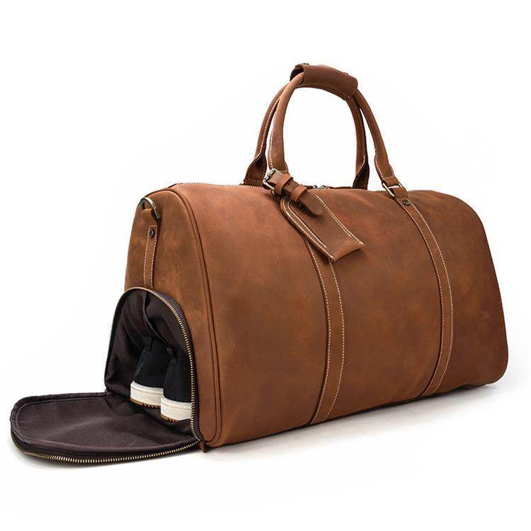Vintage leather travel duffle with spacious interior and separate shoe compartment for easy organization