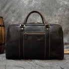 Vintage leather weekender bag with durable handles, ideal for travel and weekend getaways