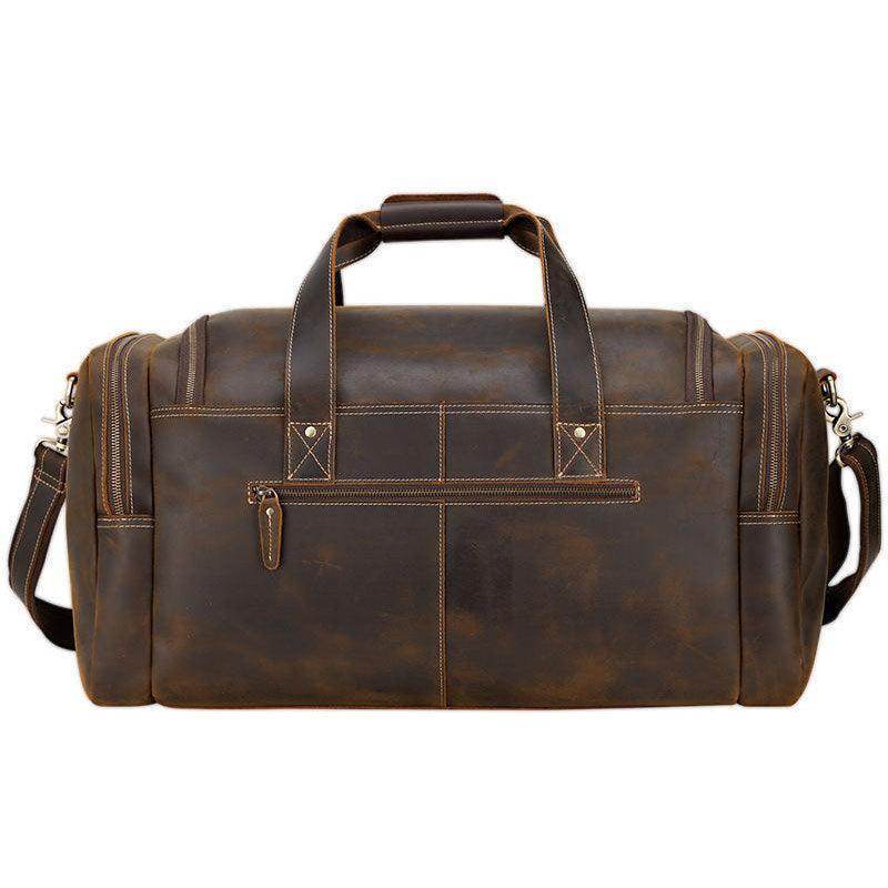 Vintage leather weekender bag with sturdy handles and spacious pockets for travel convenience