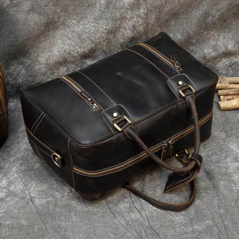 Vintage leather weekender bag with sturdy handles and detailed stitching for stylish travel