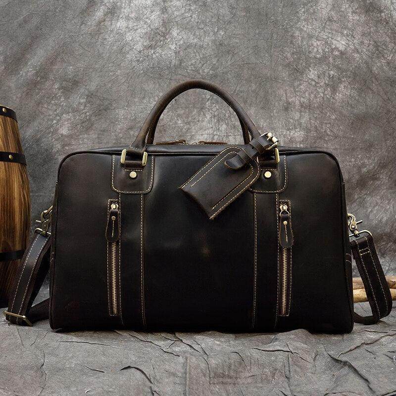 Vintage leather weekender bag with multiple pockets and durable design, perfect for travel
