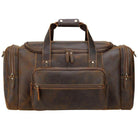 Vintage leather weekender bag with dual handles and front zipper pocket for stylish travel