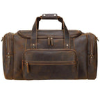 Vintage leather weekender bag with dual handles and front zipper pocket for stylish travel