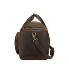 Vintage leather weekender bag with sturdy carry handles and adjustable shoulder strap for travel
