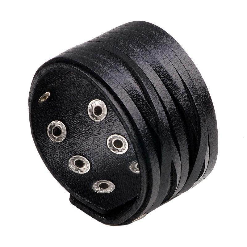 Vintage punk wristband for men made of black leather with stylish metal studs and a unique design