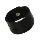 Vintage punk wristband for men made of layered black leather with adjustable snap closure