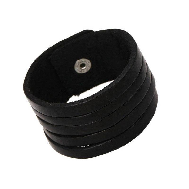 Vintage punk wristband for men made of layered black leather with adjustable snap closure