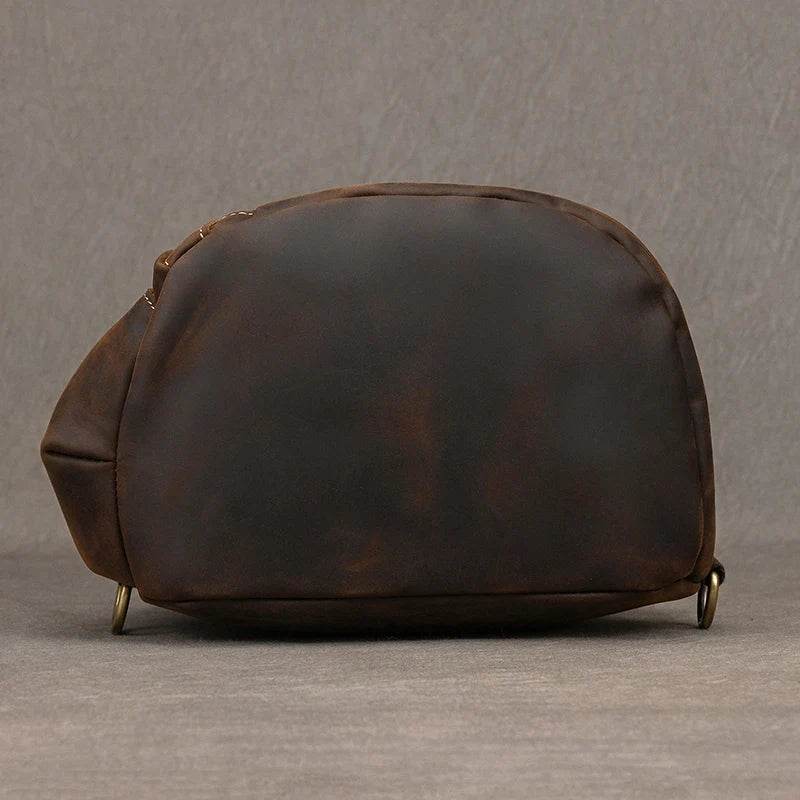 Vintage style sling bag for men in brown with a sleek design and durable material