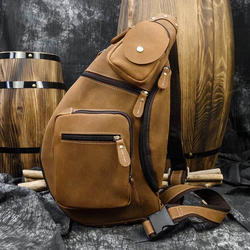 Brown vintage style sling bag for men with multiple pockets and adjustable strap