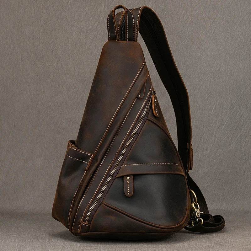 Vintage style sling bag for men in dark brown leather with multiple zipper pockets