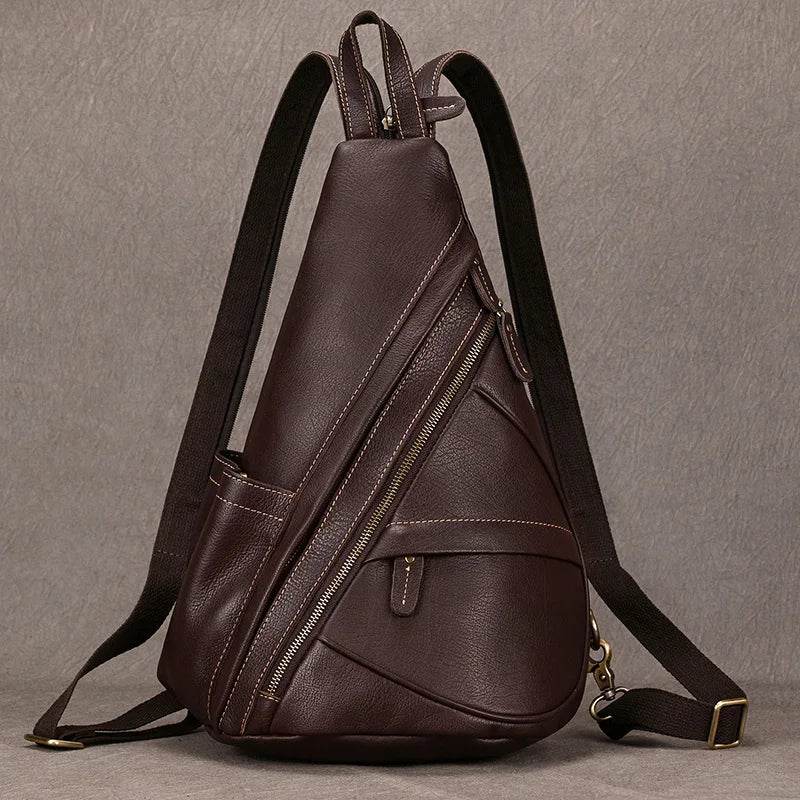 Brown vintage style sling bag for men with multiple zippers and an ergonomic design