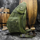 Vintage style sling bag for men in green leather with multiple pockets and adjustable strap