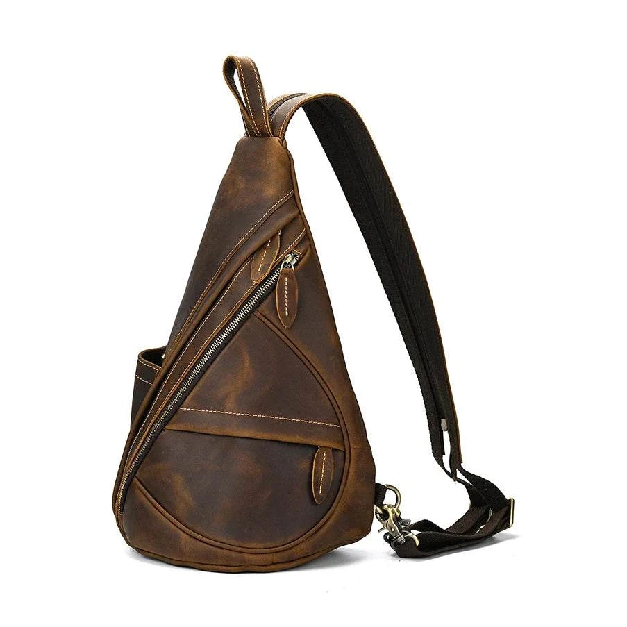 Vintage style sling bag for men in brown leather with multiple zippered pockets and an adjustable strap