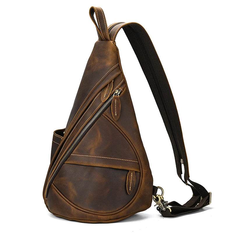 Vintage style sling bag for men in brown leather with multiple zippered pockets and an adjustable strap