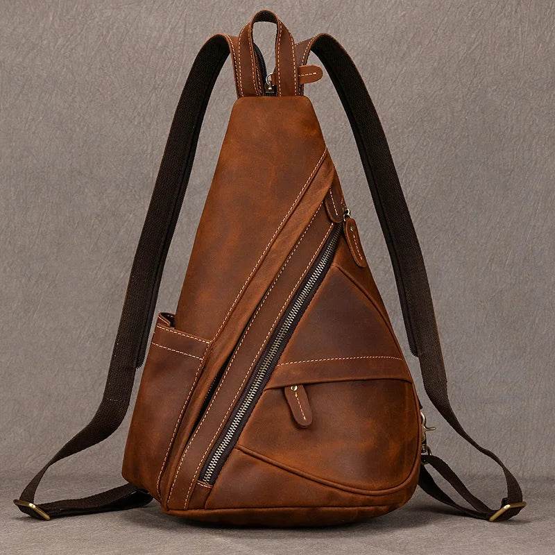 Brown vintage style sling bag for men with adjustable straps and multiple zippered pockets