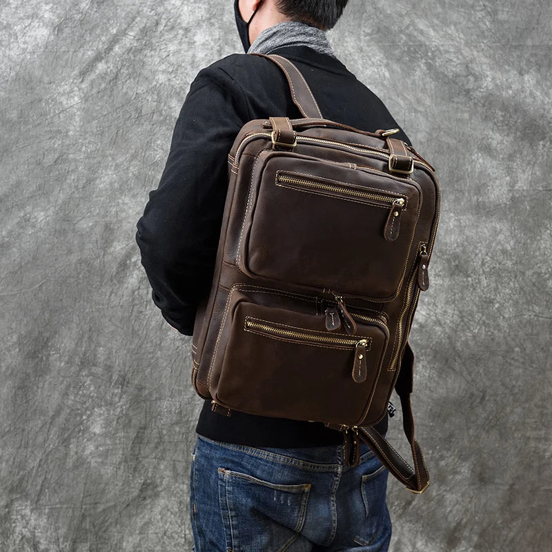 Brown vintage leather convertible backpack with front pockets on model High Quality Leather Professional Bag 3 Ways to Use .