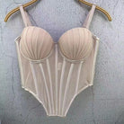Beige sexy clubwear bustier shirt with structured cups and vertical panel detailing hanging on wooden hanger