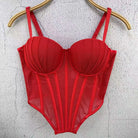 Red sexy clubwear bustier shirt with structured cups and sheer panels hanging on wooden hanger