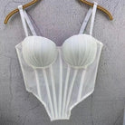White sexy clubwear bustier shirt with structured cups and adjustable straps hanging on a wooden hanger