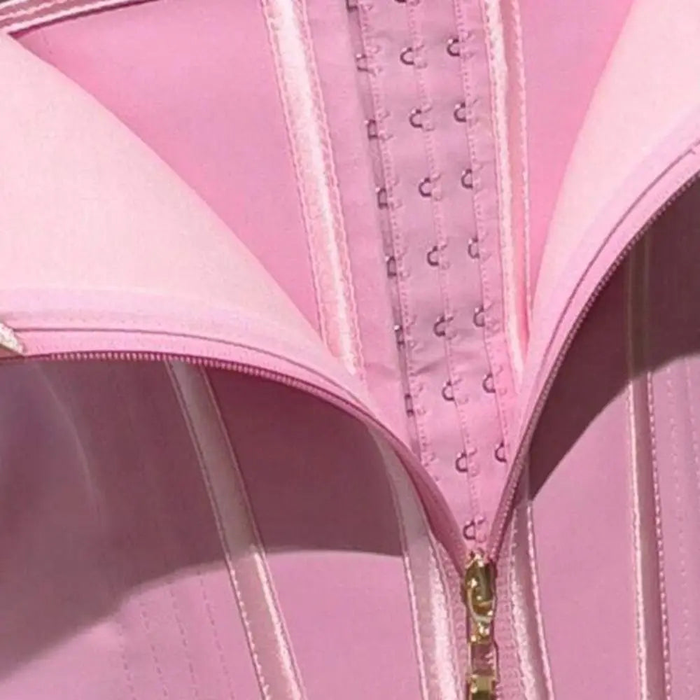 Pink waist corset trainer with hook-and-eye closure for shaping