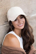 Stylish women's warm boucle ball cap in cream color, perfect for cool weather fashion