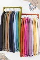Colorful collection of La Miel warm vacation jackets displayed on hangers for stylish travel options