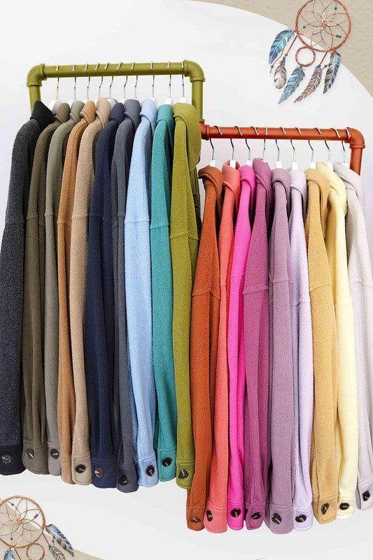 Colorful collection of La Miel warm vacation jackets displayed on hangers for stylish travel options