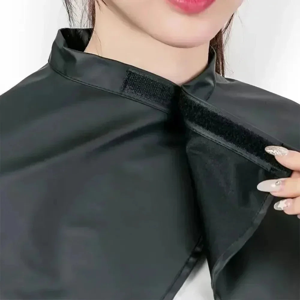 Black waterproof hairdressing cape for stylish salon use