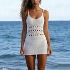 White crochet wedding dress in beach, perfect for seaside ceremonies