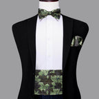 Stylish men's wedding tuxedo set featuring a leafy bow tie, pocket square, and cummerbund