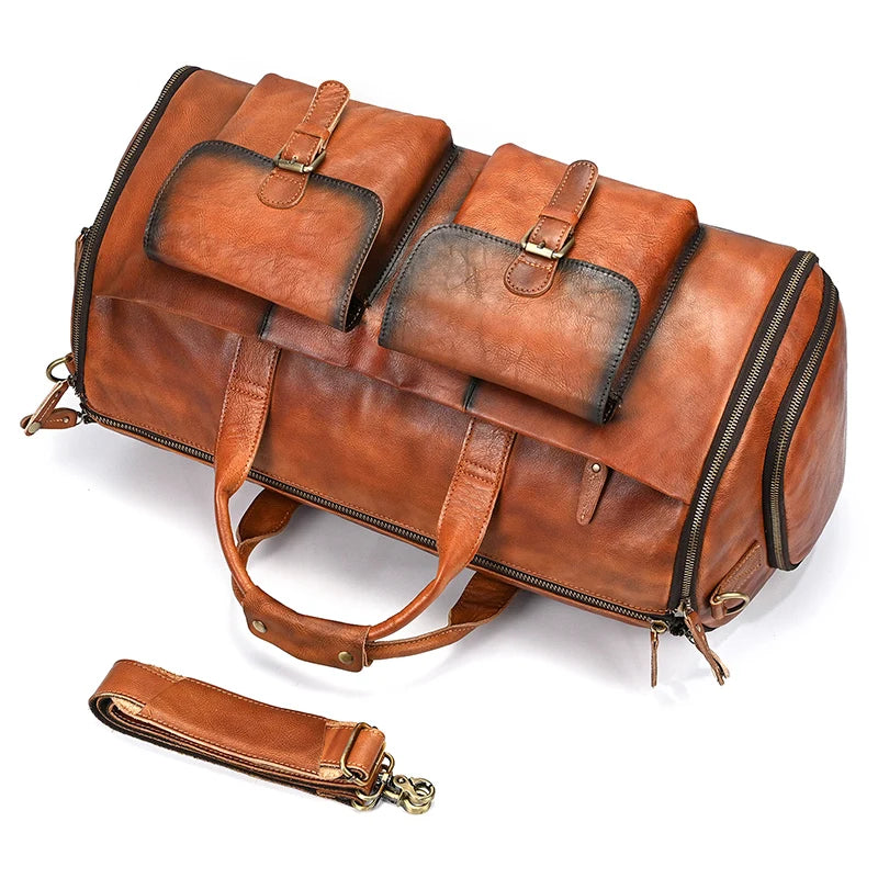 Brown leather weekender bag with two outer pockets for travel