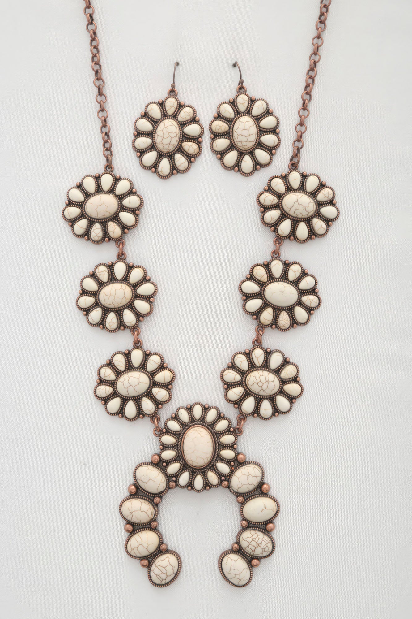 Western concho necklace for women with matching earrings featuring intricate floral design