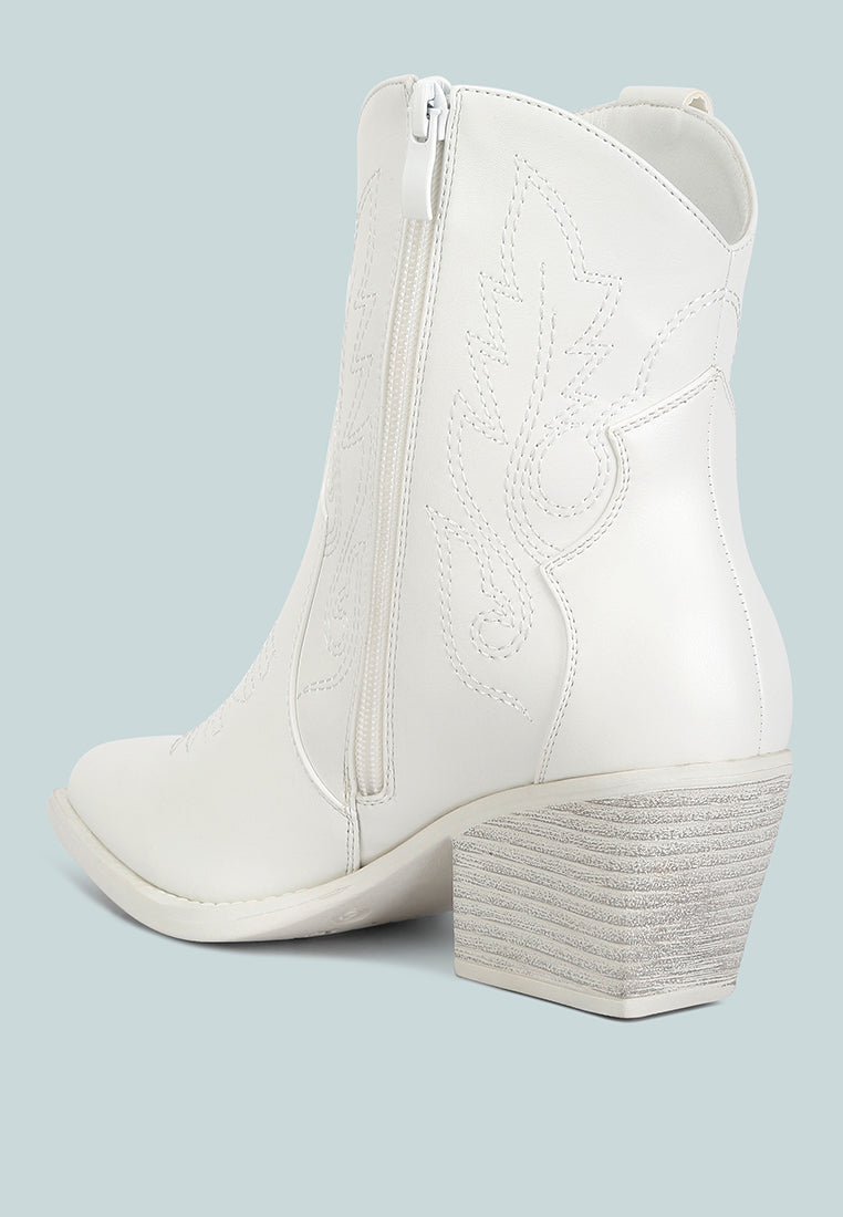 Stylish white ankle cowboy boots with a trendy design and decorative stitching from London Rag International