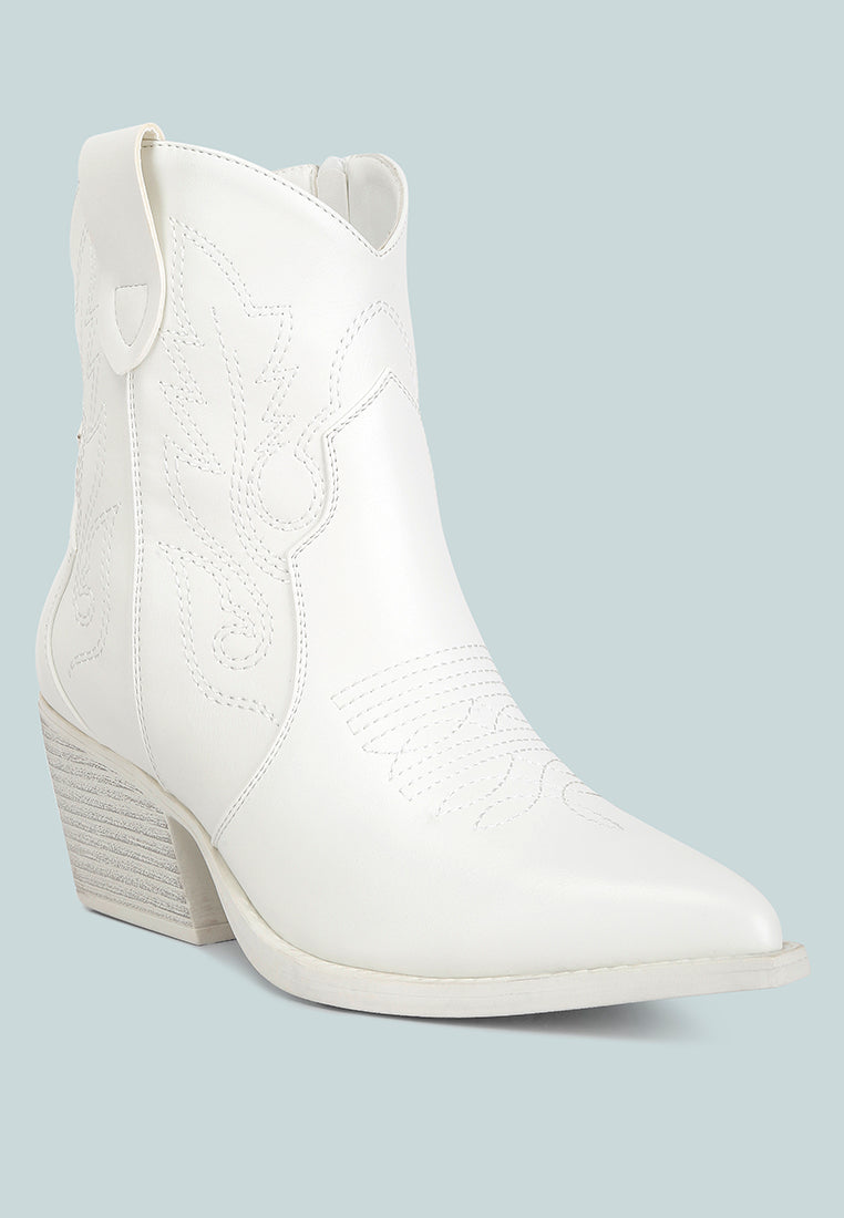 Stylish white ankle cowboy boots with intricate stitching and a chic heel for a trendy look