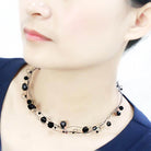Elegant white metal fashion necklace featuring black beads for a chic look