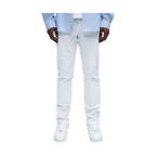 VacationGrabs white slim fit jeans for men styled with casual white sneakers and light blue shirt