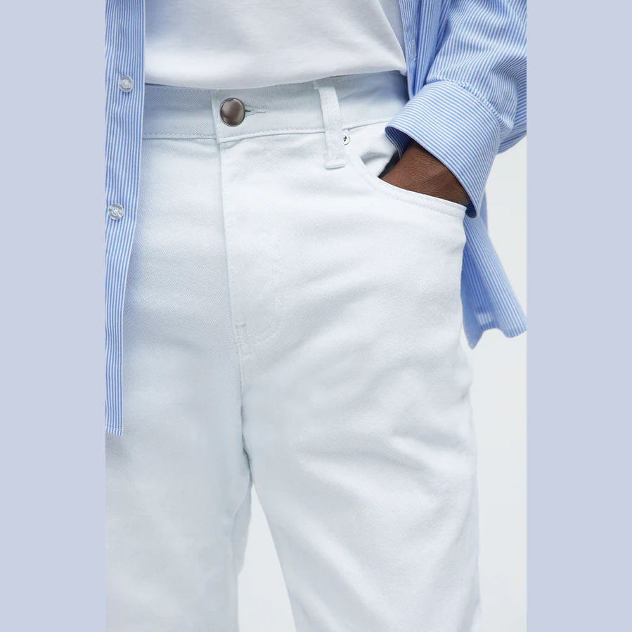 VacationGrabs white slim fit jeans for men styled with a blue striped shirt and white tee